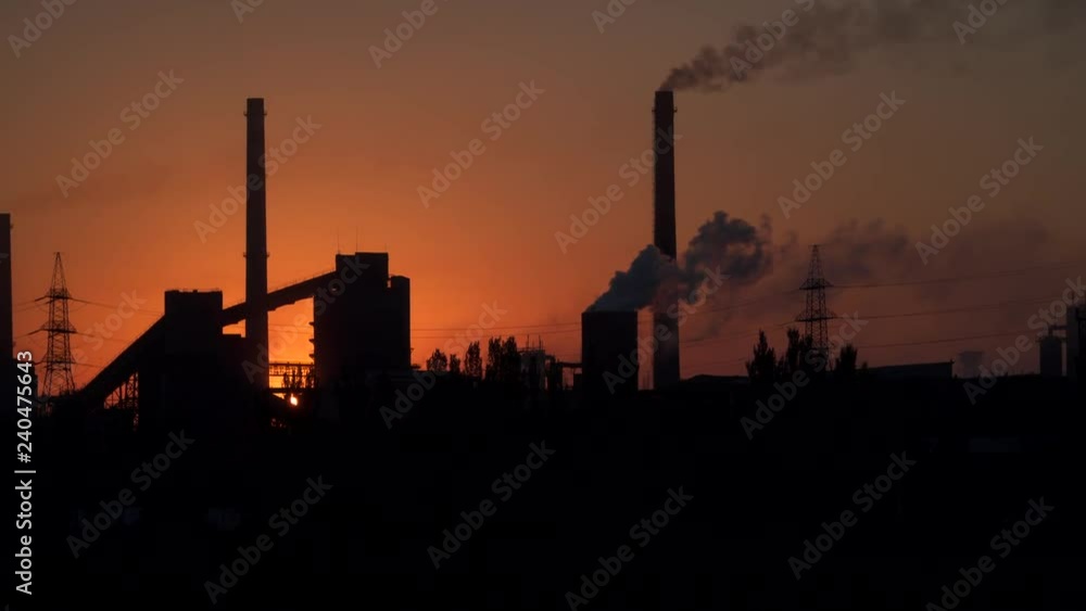 Smoke from pipes of an industrial enterprise at dawn. Smoke from pipes of an industrial enterprise at dawn.