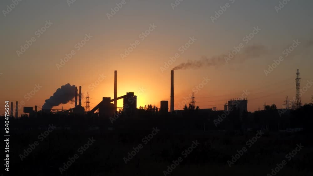 Pipes of an industrial enterprise at dawn. Pipes of an industrial enterprise at dawn.