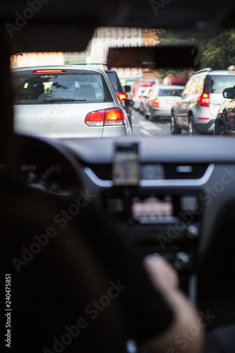 Traffic jam in a city with row of cars on the road during rush hour