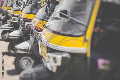Auto rickshaws or "tuk-tuk" taxi on a street. Selective Focus.
