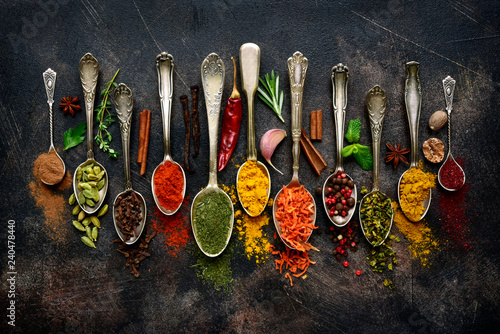 Fototapeta Naklejka Na Ścianę i Meble -  Assortment of natural spices on a vintage spoons.Top view with copy space.