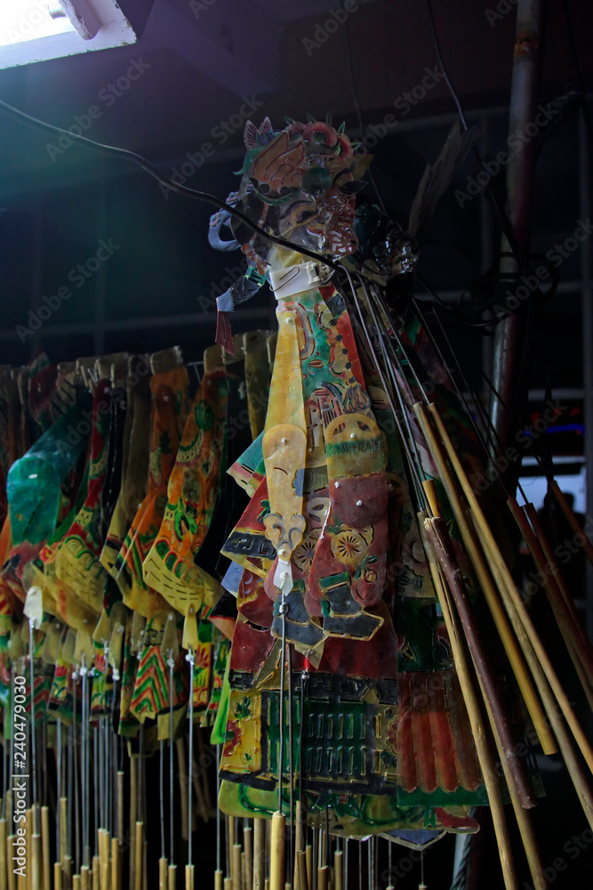 Naklejka premium Chinese shadow play props hanging in the night