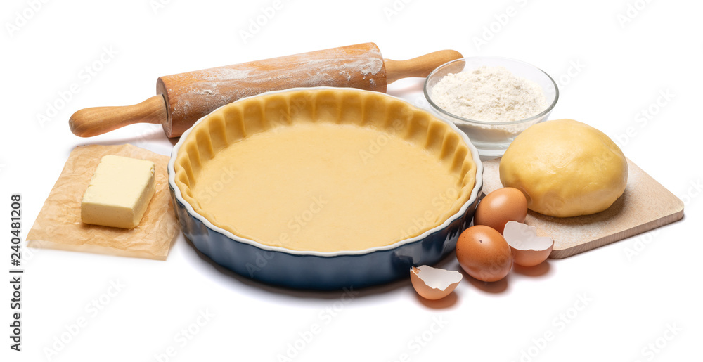 shortbread dough for baking quiche tart and ingredients in baking form shortbread dough for baking quiche tart and ingredients in baking form