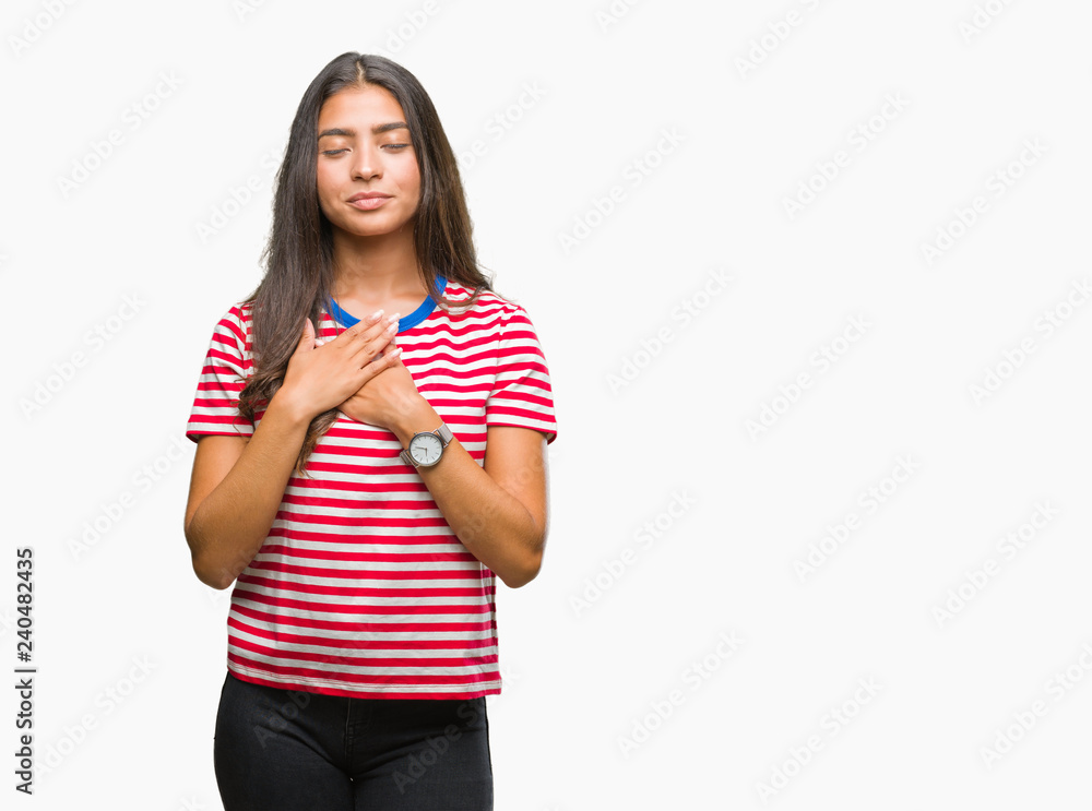 Young beautiful arab woman over isolated background smiling with hands on chest with closed eyes and grateful gesture on face. Health concept. Young beautiful arab woman over isolated background smiling with hands on chest with closed eyes and grateful gesture on face. Health concept.