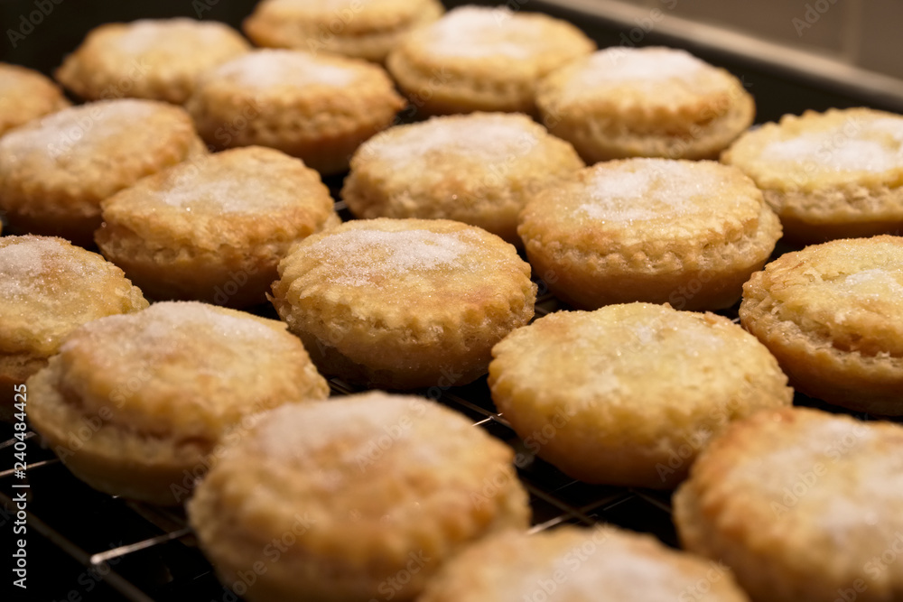Mince pies fresh homemade by hand close up from above at Christmas on tray