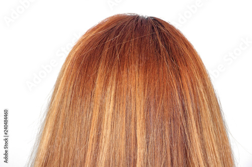 Long full blond hair of a woman from behind