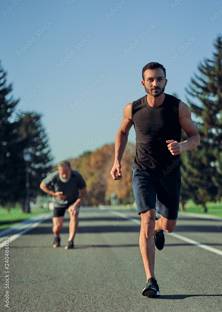 The two sportsmen jogging on the road