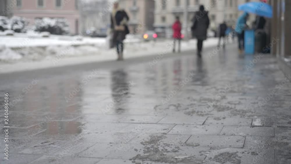 Peoples and cars on street in winter blurred Peoples and cars on street in winter blurred
