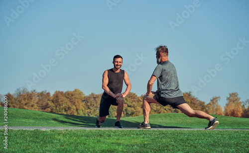 The two men doing exercise outdoor