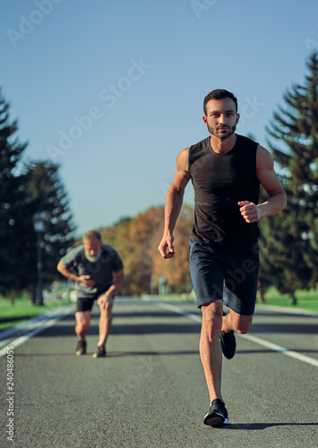 The two sportsmen jogging on the road