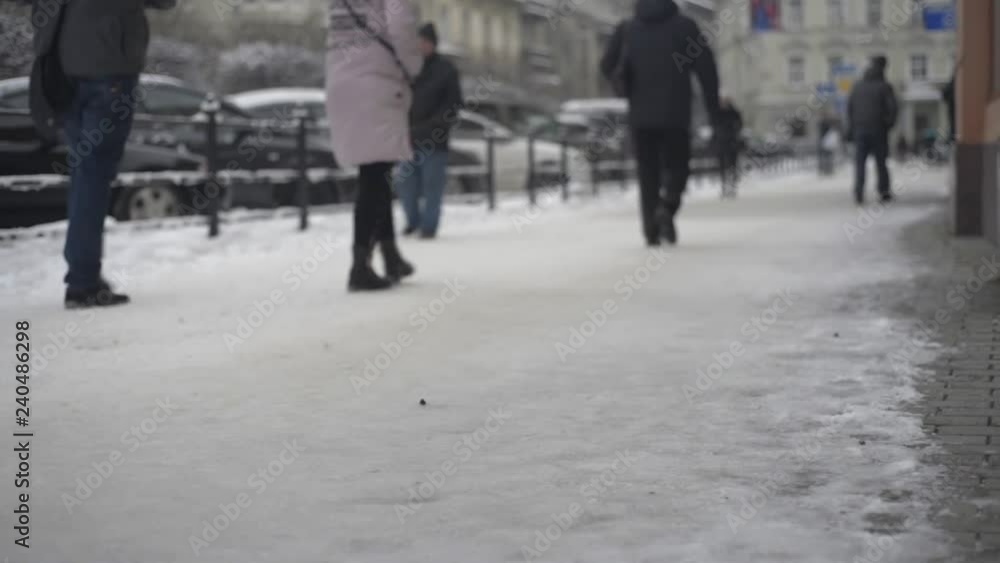 Peoples and cars on street in winter blurred Peoples and cars on street in winter blurred
