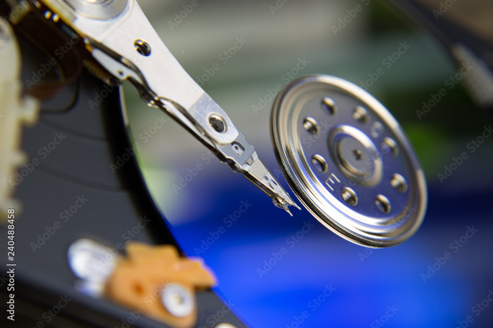 Hard drive from computer or laptop lies on the table in the repair shop. Performs fault diagnostics and performs urgent repairs recovery of lost data during deletion HDD closeup Hard drive from computer or laptop lies on the table in the repair shop. Performs fault diagnostics and performs urgent repairs recovery of lost data during deletion HDD closeup
