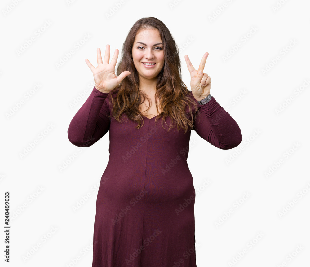 Beautiful and attractive plus size young woman wearing a dress over isolated background showing and pointing up with fingers number seven while smiling confident and happy. Beautiful and attractive plus size young woman wearing a dress over isolated background showing and pointing up with fingers number seven while smiling confident and happy.