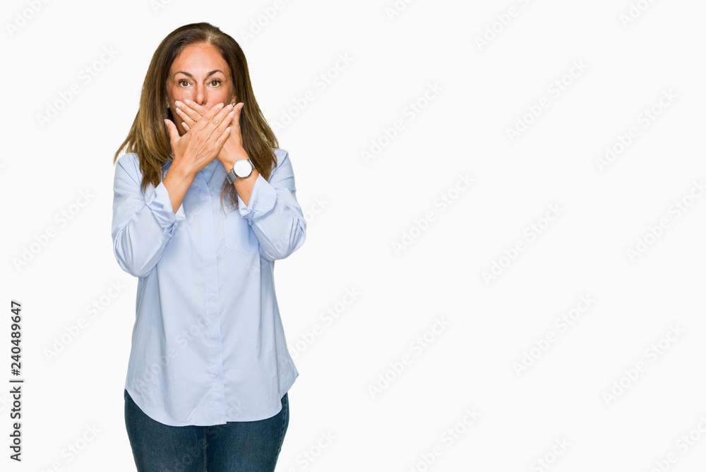 Beautiful middle age business adult woman over isolated background shocked covering mouth with hands for mistake. Secret concept. Beautiful middle age business adult woman over isolated background shocked covering mouth with hands for mistake. Secret concept.