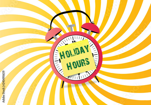 Handwriting text writing Holiday Hours on stocky note on alarm clock photo