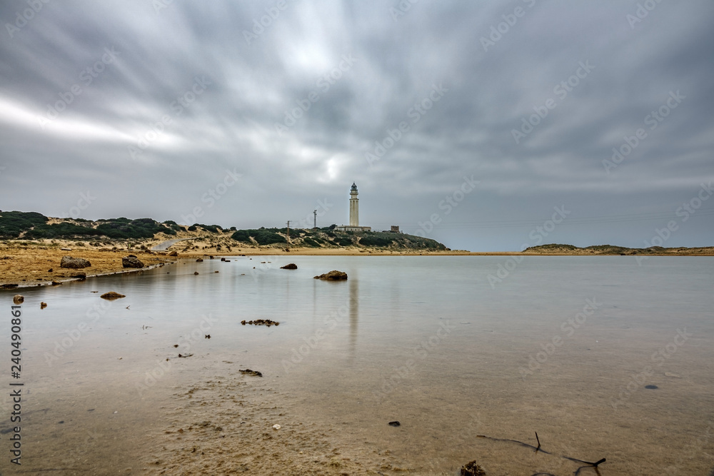 Trafalgar lighthouse reflected in the pond with cloudy sky