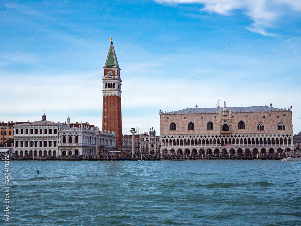 San Marco square or piazza and Doges Palace panoramic view from speed boat on sea or canal Beautiful renaissance italian architecture landmarks of Venezia Venetian cityscape travel background Day time