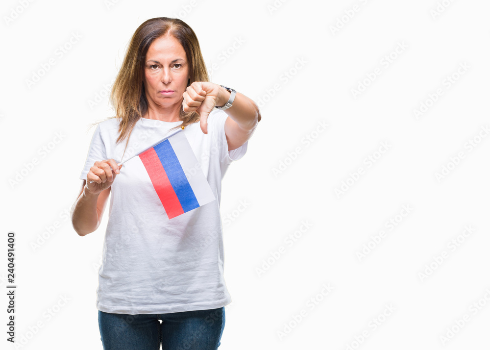 Middle age hispanic woman holding flag of Russia over isolated background with angry face, negative sign showing dislike with thumbs down, rejection concept Middle age hispanic woman holding flag of Russia over isolated background with angry face, negative sign showing dislike with thumbs down, rejection concept