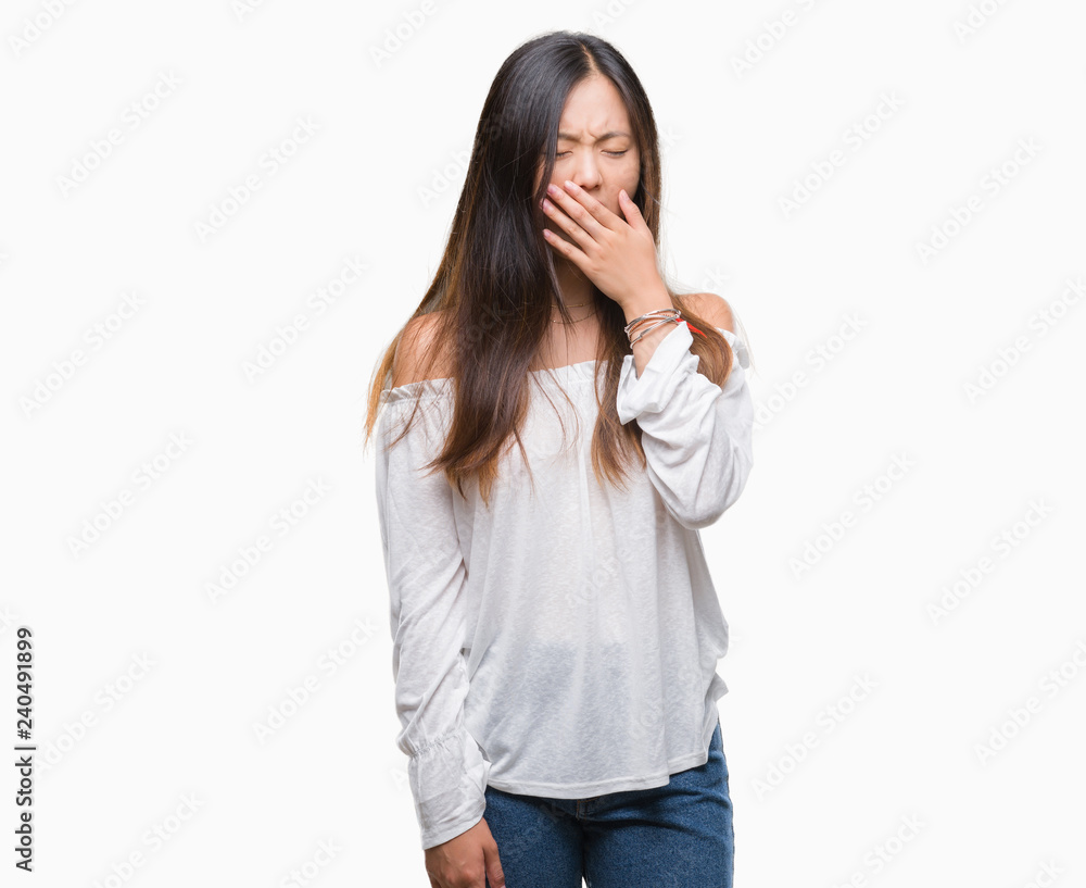 Young asian woman over isolated background bored yawning tired covering mouth with hand. Restless and sleepiness. Young asian woman over isolated background bored yawning tired covering mouth with hand. Restless and sleepiness.