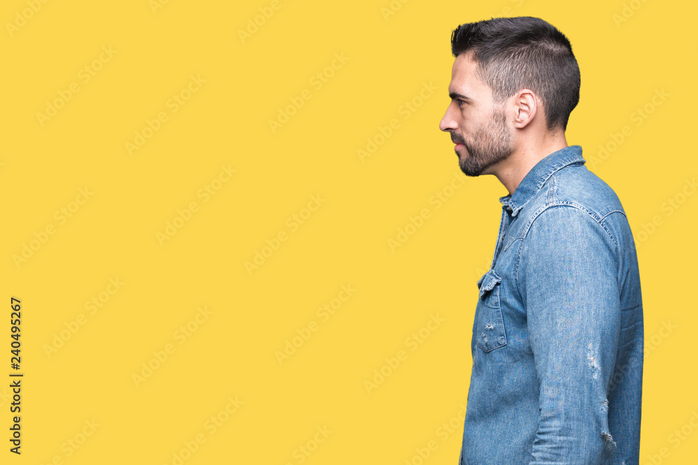 Young handsome man over isolated background looking to side, relax profile pose with natural face with confident smile. Young handsome man over isolated background looking to side, relax profile pose with natural face with confident smile.