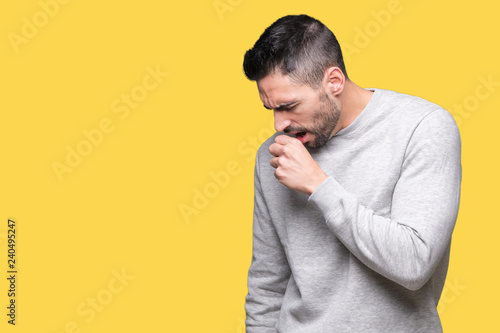 Young handsome man wearing sweatshirt over isolated background feeling unwell and coughing as symptom for cold or bronchitis. Healthcare concept.