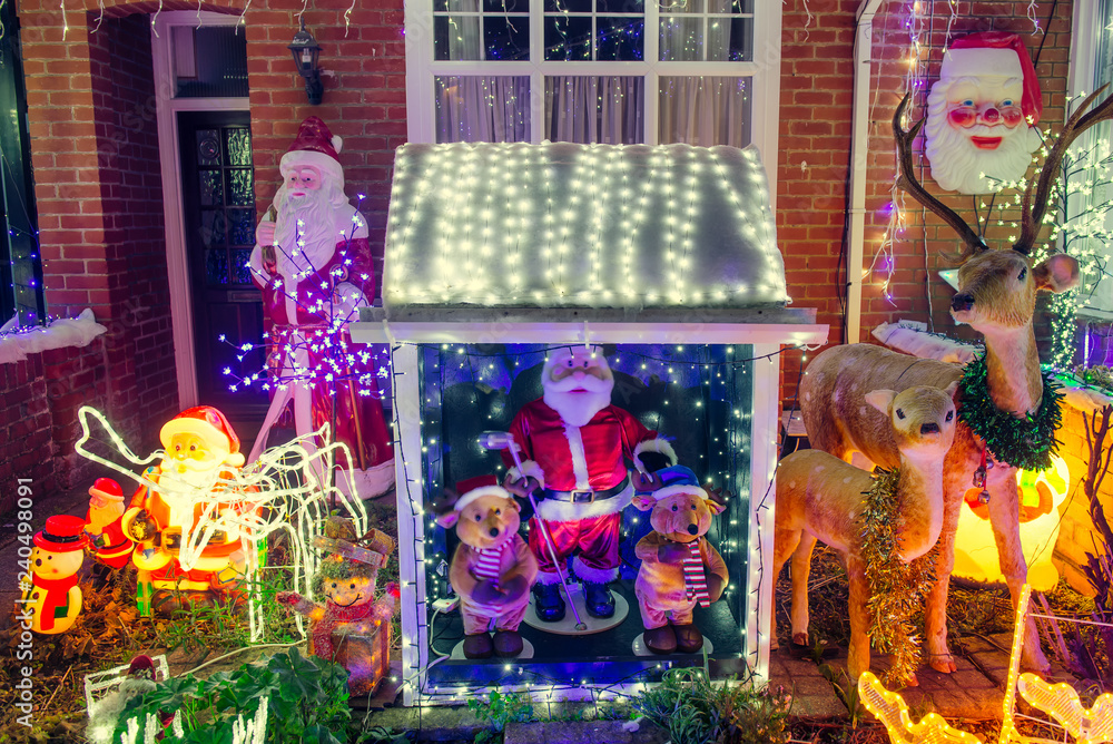 December 2018, New Milton, United Kingdom - Decorated and Lighted houses for Christmas and New Year at Night. Outdoor decor for holidays. Festive mood.