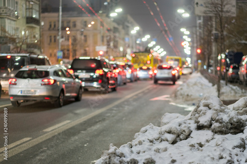 Night road in the city of lights cars traffic jams. Winter traffic in the city. © jollier_