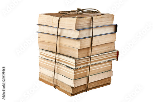 Bundle of old books tied up with string. Isolated on white background