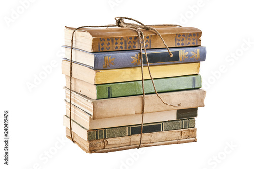 Bundle of old books tied up with string. Isolated on white background