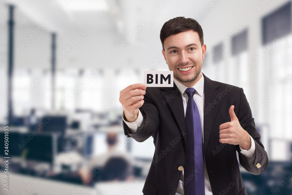 Business, technology, internet and networking concept. Young entrepreneur showing keyword: BIM Business, technology, internet and networking concept. Young entrepreneur showing keyword: BIM