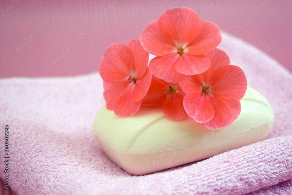 Fragrant flower soap on a pink towel. Fragrant flower soap on a pink towel.