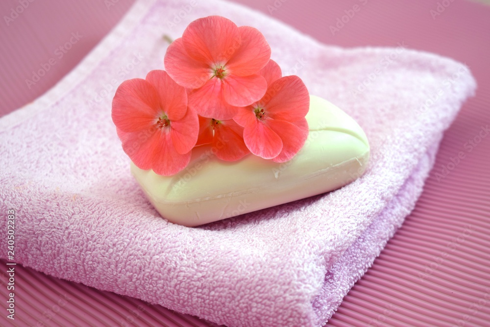 Fragrant flower soap on a pink towel. Fragrant flower soap on a pink towel.