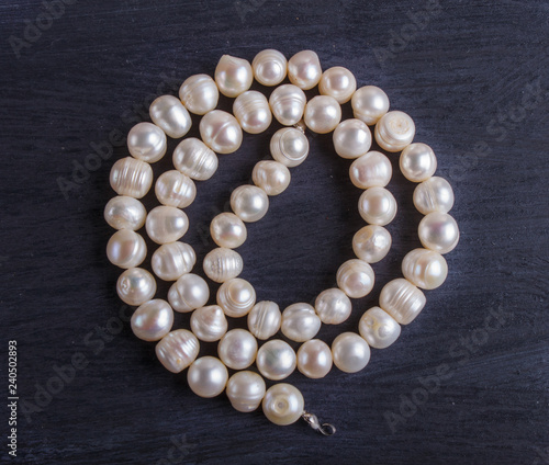 white pearl beads on a black background