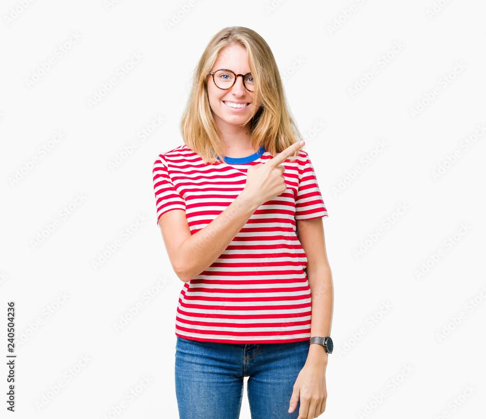 Beautiful young woman wearing glasses over isolated background cheerful with a smile of face pointing with hand and finger up to the side with happy and natural expression on face Beautiful young woman wearing glasses over isolated background cheerful with a smile of face pointing with hand and finger up to the side with happy and natural expression on face