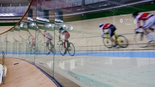 Men ride a bicycle, cycling. Cycling track Pursuit competition sequence.