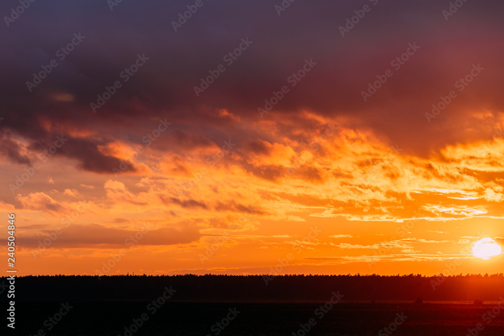Sun At Sunset  Sunrise Sky. Bright Dramatic Sky With Clouds. Yel