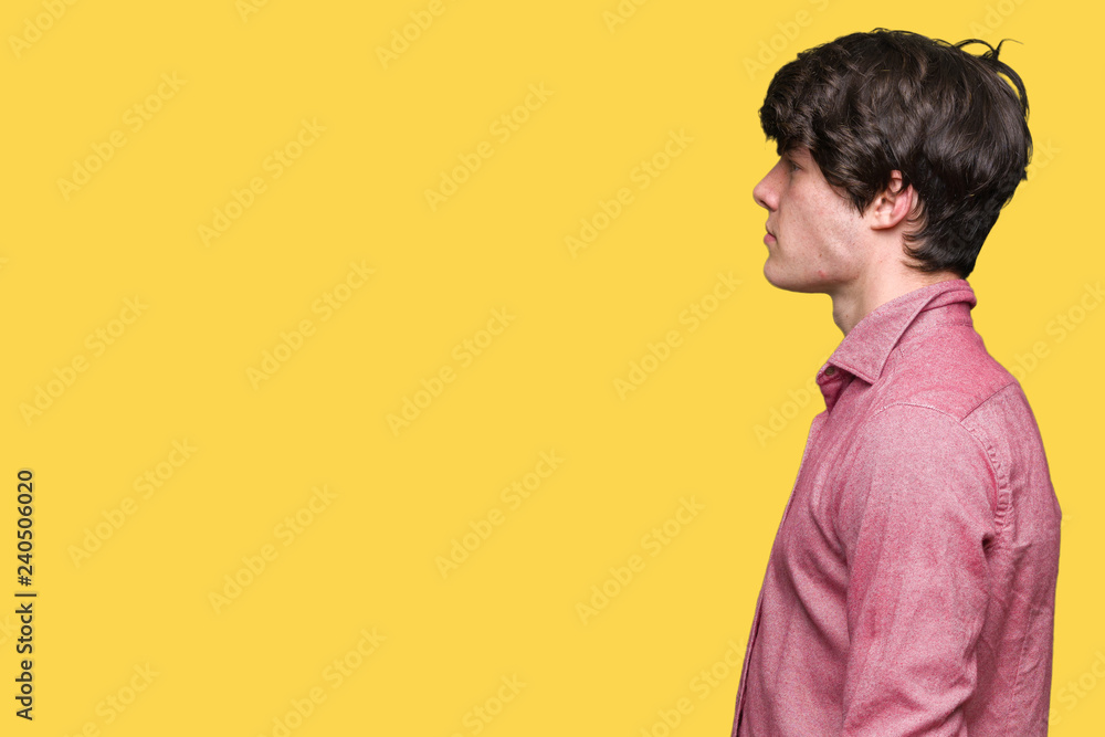 Young handsome business man over isolated background looking to side, relax profile pose with natural face with confident smile. Young handsome business man over isolated background looking to side, relax profile pose with natural face with confident smile.