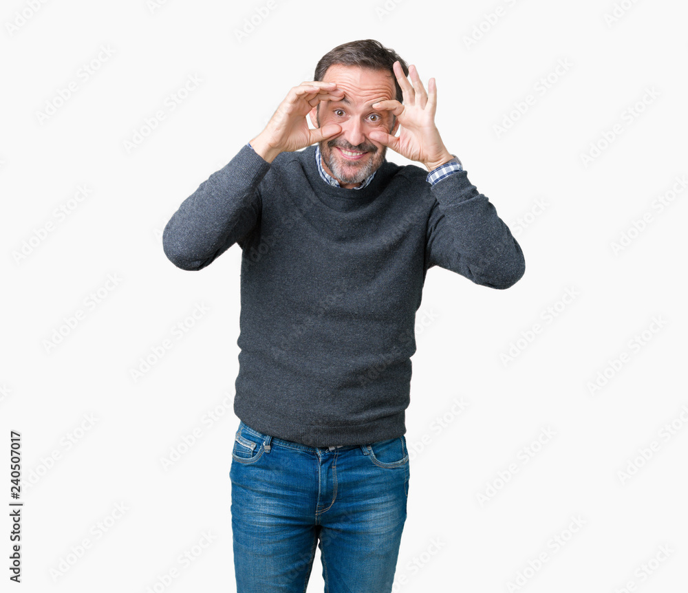 Handsome middle age senior man wearing a sweater over isolated background Trying to open eyes with fingers, sleepy and tired for morning fatigue Handsome middle age senior man wearing a sweater over isolated background Trying to open eyes with fingers, sleepy and tired for morning fatigue