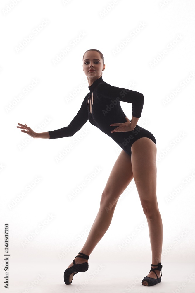 Young and incredibly beautiful ballerina is posing and dancing Young and incredibly beautiful ballerina is posing and dancing