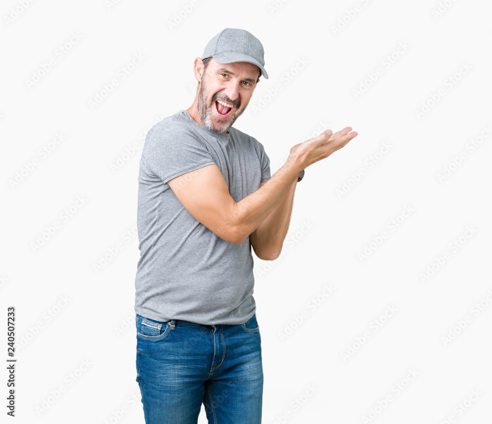 Handsome middle age hoary senior man wearing sport cap over isolated background Pointing to the side with hand and open palm, presenting ad smiling happy and confident Handsome middle age hoary senior man wearing sport cap over isolated background Pointing to the side with hand and open palm, presenting ad smiling happy and confident