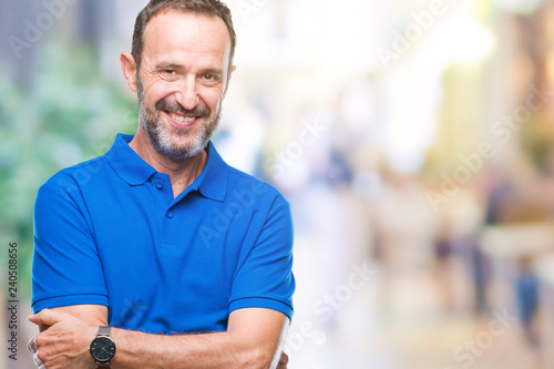 Middle age hoary senior man over isolated background happy face smiling with crossed arms looking at the camera. Positive person.