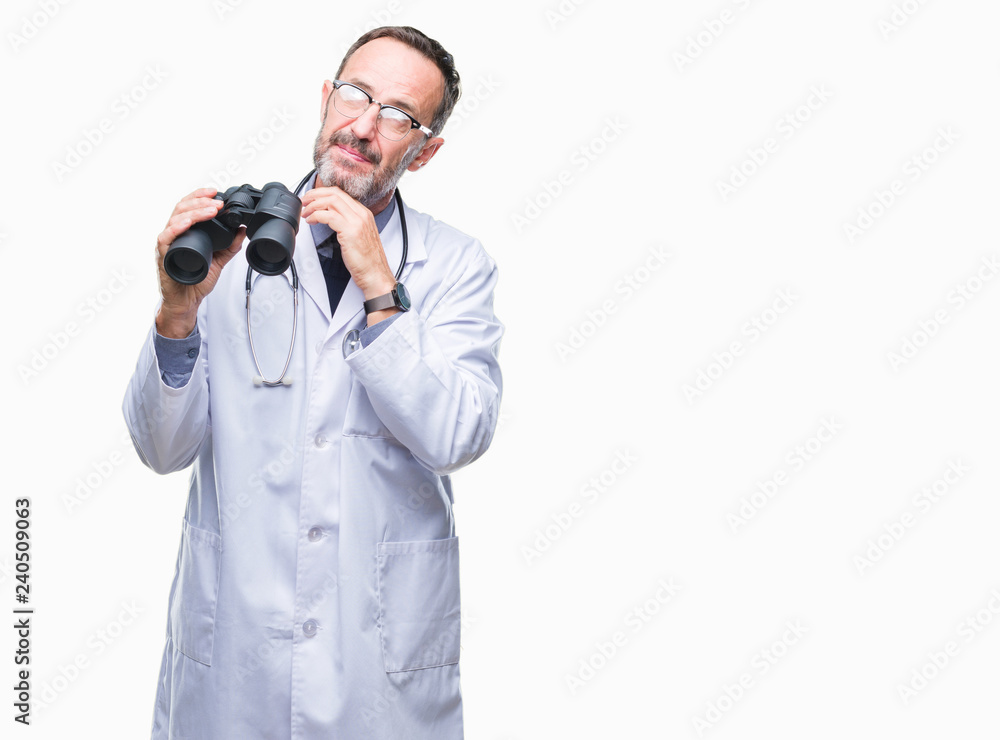 Middle age senior hoary doctor man looking through binoculars isolated background serious face thinking about question, very confused idea Middle age senior hoary doctor man looking through binoculars isolated background serious face thinking about question, very confused idea