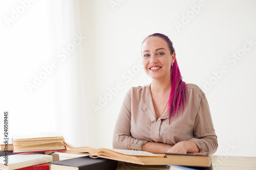 beautiful business woman with pink hair at the table in the Office work