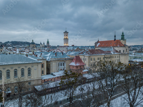 LVOV, UKRAINE - 25, December 2018. Panorama of the ancient city. Ukraine Lviv City Council, Town Hall. The roofs of old buildings. Aerial view. Winter