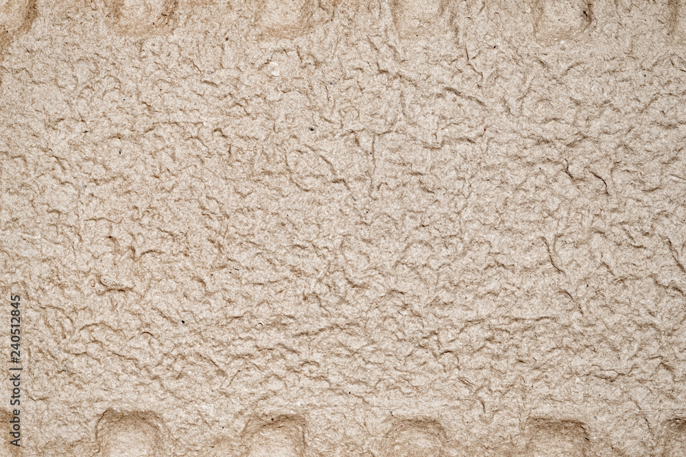 Uneven cardboard surface texture with fibers paper background