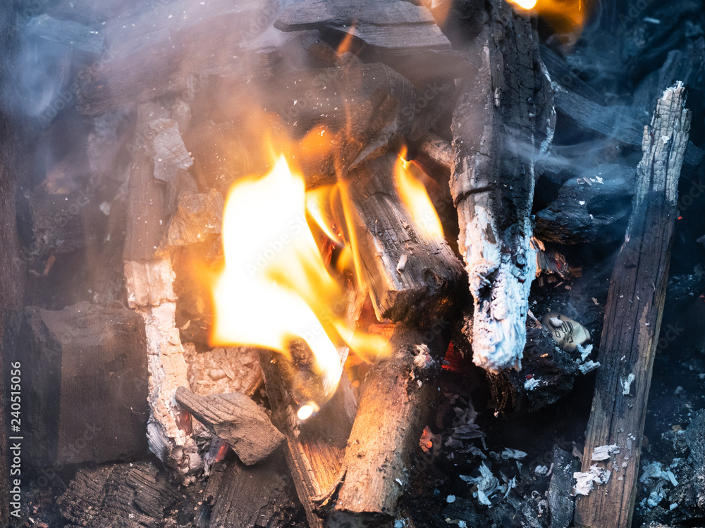 burning firewood and charcoal close up burning firewood and charcoal close up