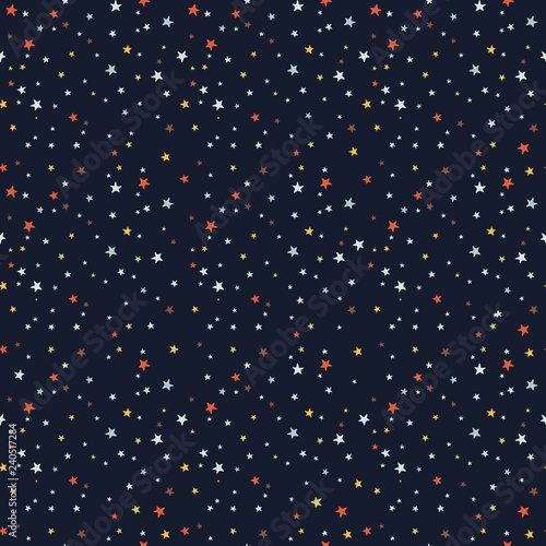 Seamless vector pattern with colored stars of various sizes on dark background. Childish background for postcards, wallpaper, papers, textiles, bed linen, tissue 1.1