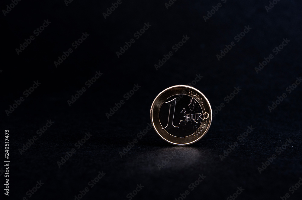 shiny one Euro coin on black background