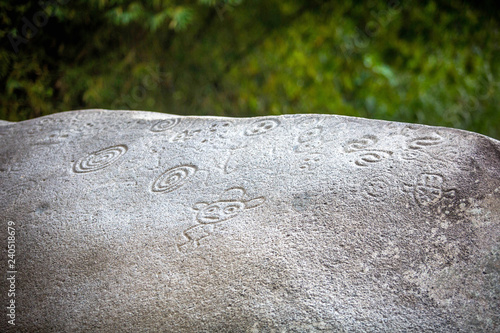 Fotografija Ancient carved figures on stones in Jayuya Puerto Rico