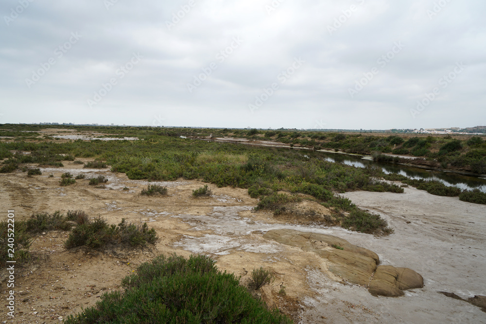 Salt lakes in Portugal in the Algarve on the border with Spain and its product in close up Salt lakes in Portugal in the Algarve on the border with Spain and its product in close up